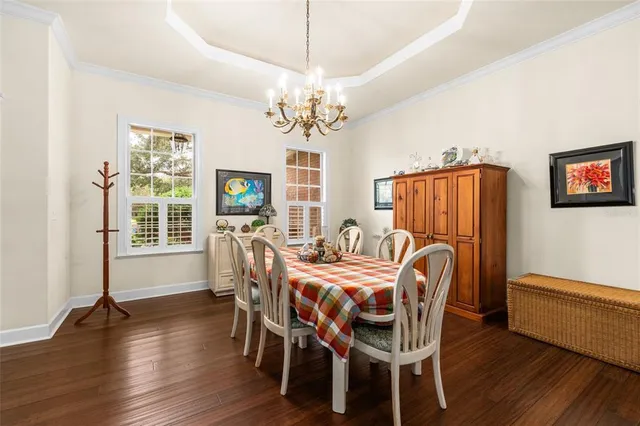 a view of a workspace with furniture and a bookshelf