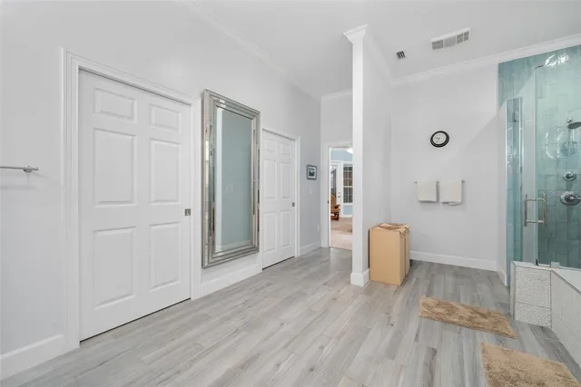 a bathroom with a granite countertop sink a toilet a mirror a vanity and bathtub