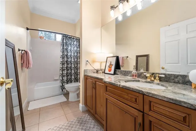 a view of a livingroom with gym equipment and a window