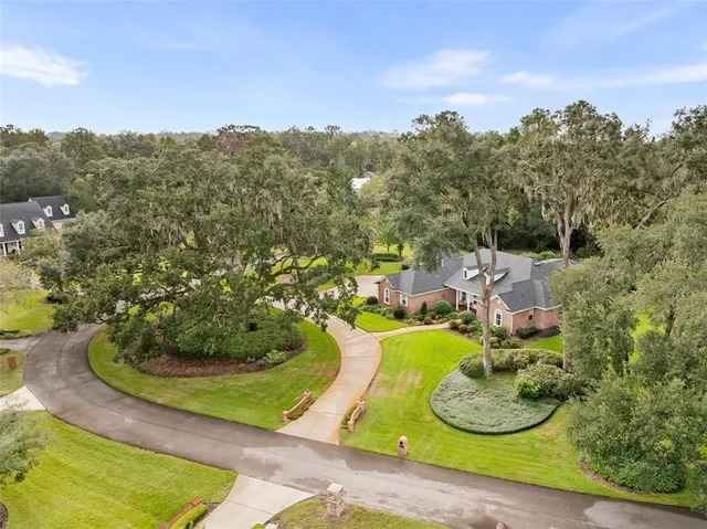 a view of kitchen with stainless steel appliances granite countertop a stove and a sink