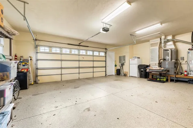 a view of yard with flowers and tree