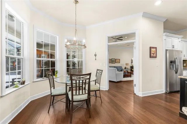 a living room with furniture a fireplace and a table