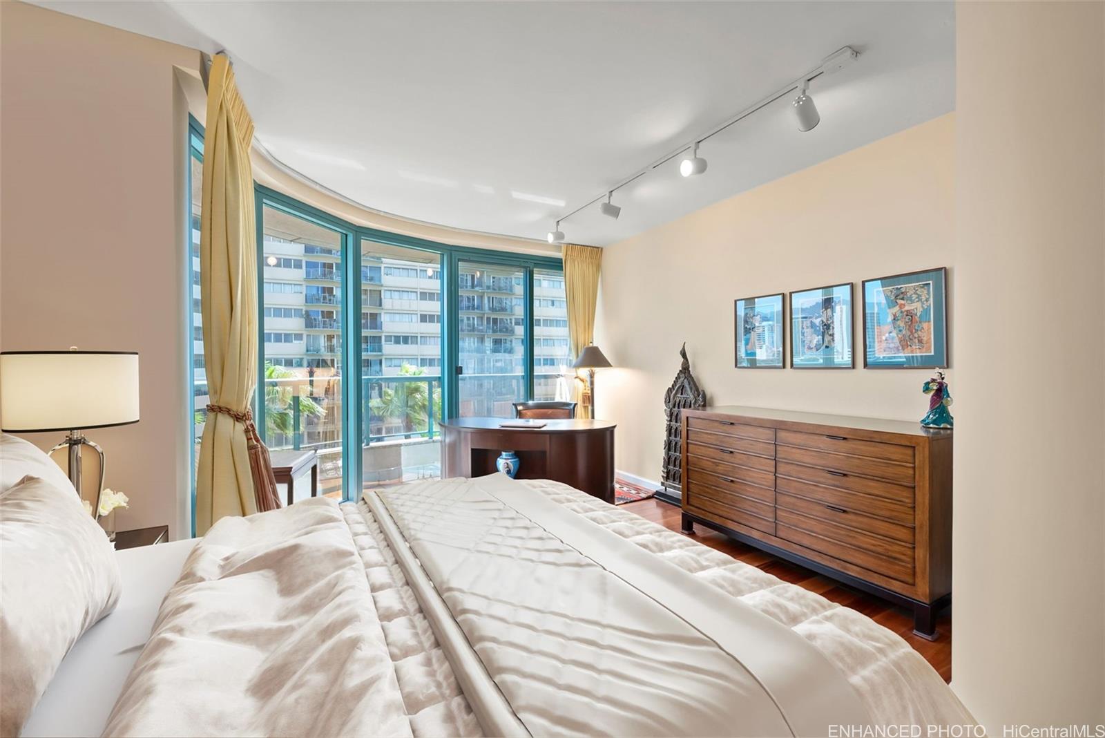 1888 Kalakaua Avenue, Unit 907 Honolulu, HI 96815 - Photo 13 of 25 a bedroom with a large bed and a window