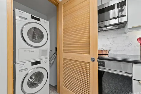 a kitchen with a washer and dryer