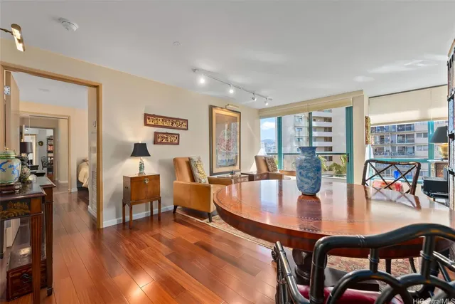 a view of a dining room with furniture and window