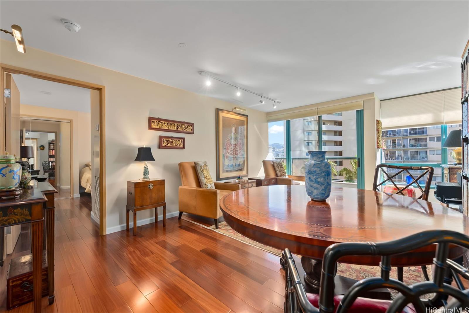1888 Kalakaua Avenue, Unit 907 Honolulu, HI 96815 - Photo 8 of 25 a view of a dining room with furniture and window