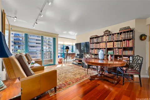 a work room with furniture and a book shelf