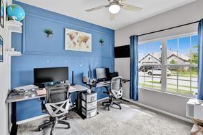 5821 Rostherne Drive Aubrey, TX 76227 - Photo 11 of 21 a view of a workspace with furniture and a window