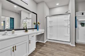 5821 Rostherne Drive Aubrey, TX 76227 - Photo 13 of 21 a spacious bathroom with a shower sink and mirror