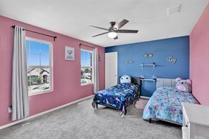 5821 Rostherne Drive Aubrey, TX 76227 - Photo 14 of 21 a bedroom with two beds and a window