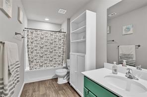 5821 Rostherne Drive Aubrey, TX 76227 - Photo 15 of 21 a bathroom with a sink a toilet and shower