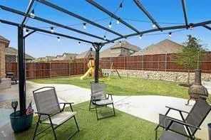 a view of a chair and table in the patio