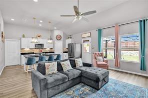 5821 Rostherne Drive Aubrey, TX 76227 - Photo 8 of 21 a living room with furniture and a large window