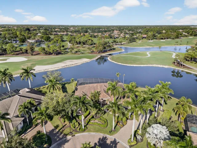 an aerial view of a house with a lake view