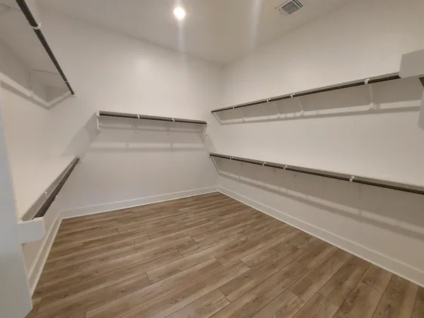 a view of an empty walk in closet