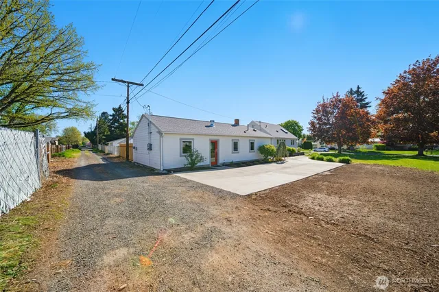 a road view with a house
