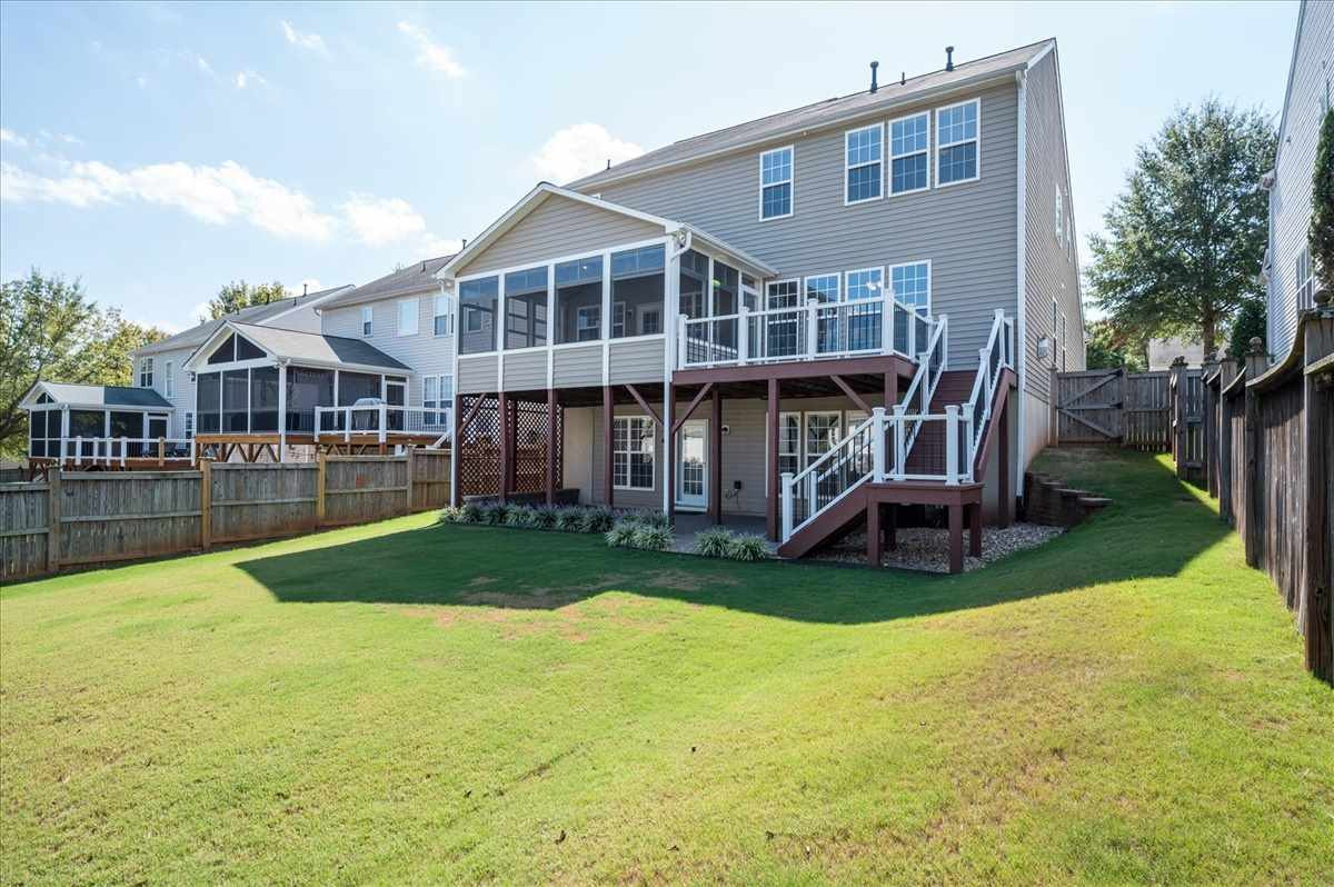 7810 San Gabriel Street Raleigh, NC 27613 - Photo 17 of 29 Fenced backyard, three season room, deck and lower level patio Backyard