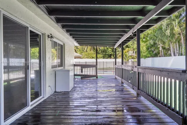 a view of a house with a yard and a garden