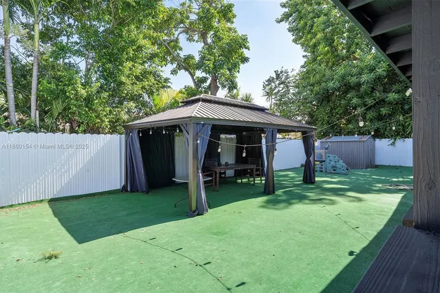 a backyard of a house with lots of green space