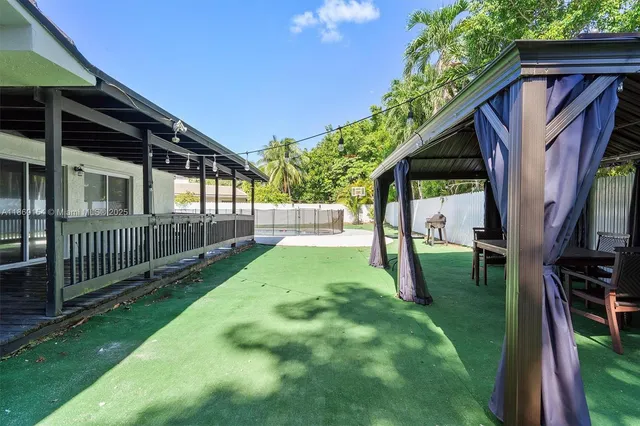an aerial view of a house with a swimming pool