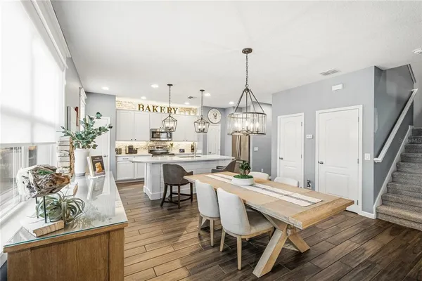 a kitchen with a table and chairs in it