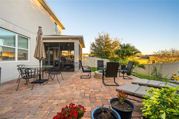 swimming pool view with a seating space