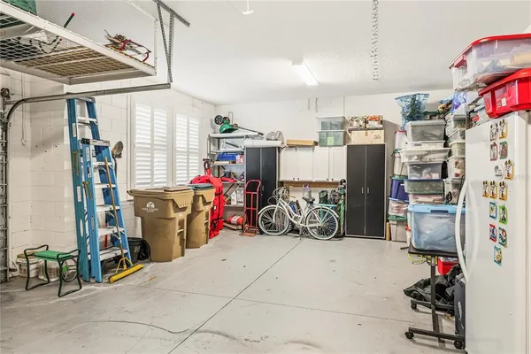 a bathroom with a toilet a sink and a wooden floor