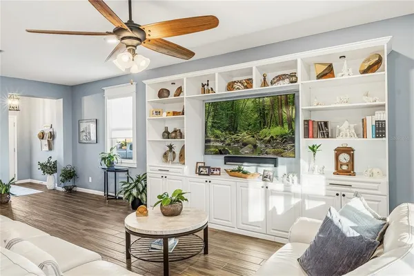a living room with furniture and a window
