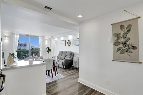 a view of a livingroom with furniture and wooden floor