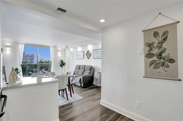 a view of a livingroom with furniture and wooden floor