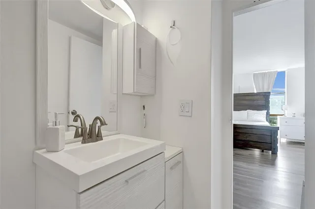 a view of bathroom sink and mirror