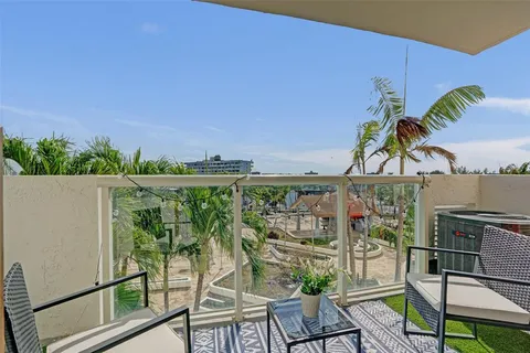 a view of a chairs and table in patio