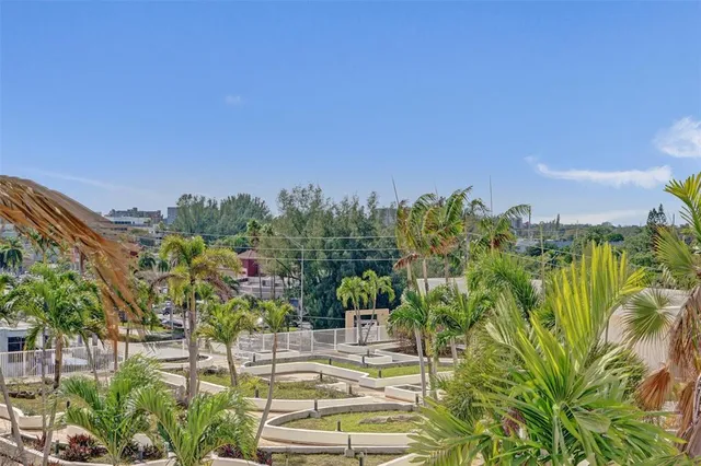 a swimming pool with outdoor seating and city view