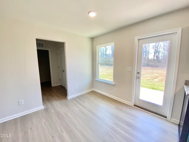 a bathroom with a sink a toilet a mirror and vanity