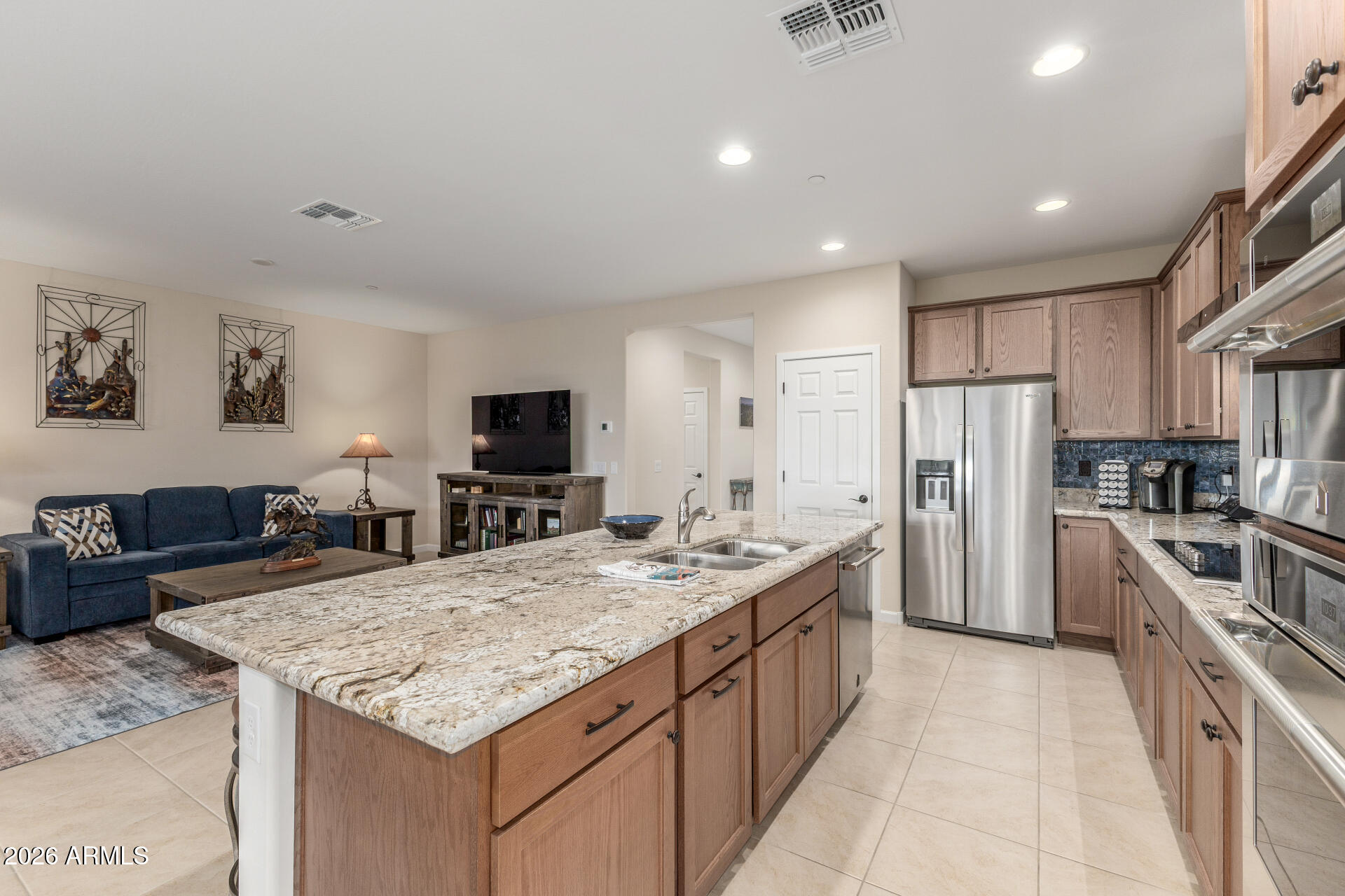 18325 East Spring Valley Court Rio Verde, AZ 85263 - Photo 15 of 50 a large kitchen with kitchen island a sink stove and refrigerator