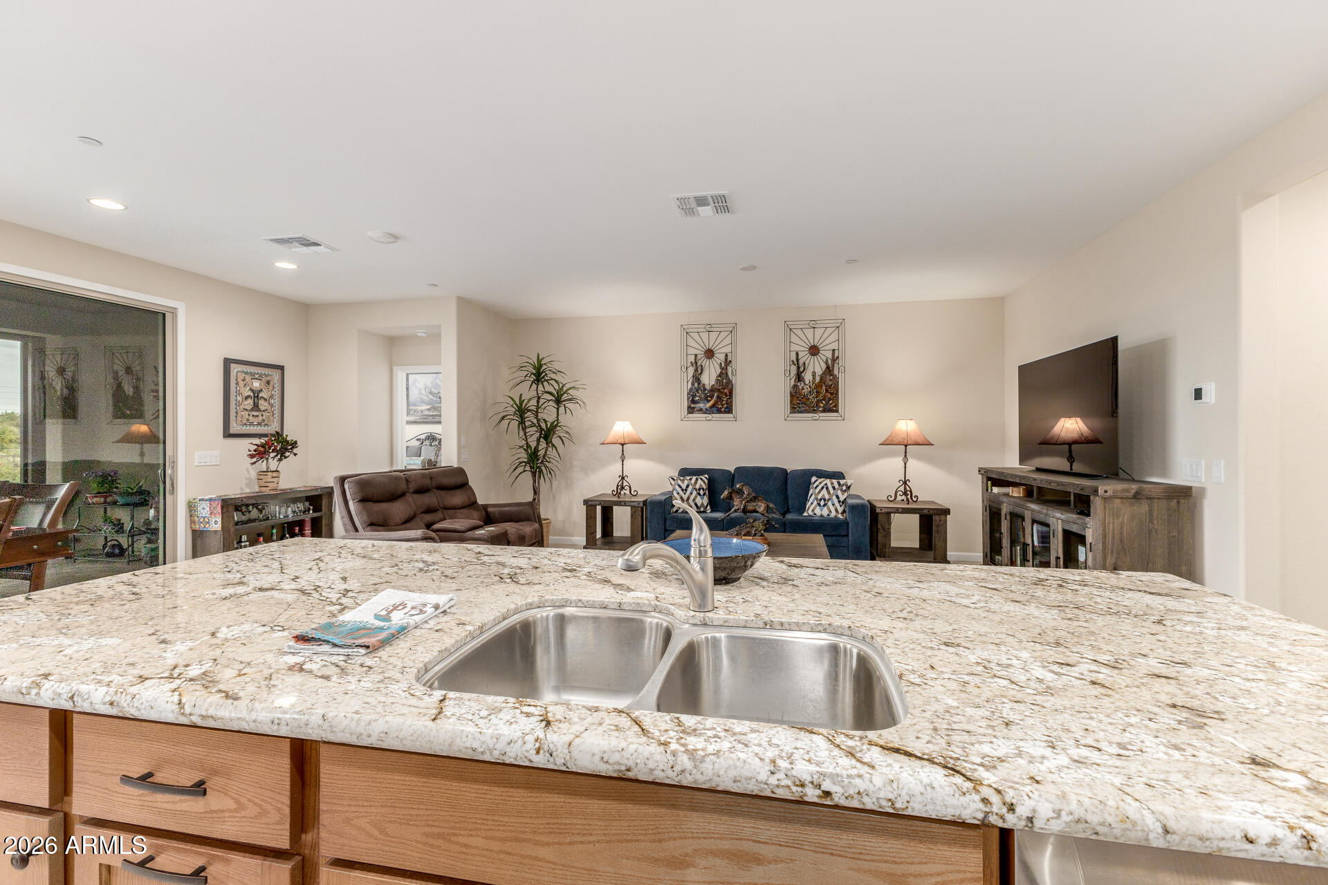18325 East Spring Valley Court Rio Verde, AZ 85263 - Photo 16 of 50 a kitchen with granite countertop a sink and a counter top space