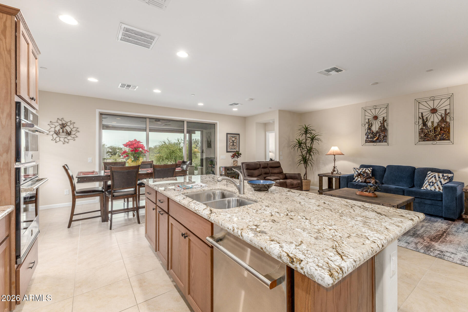 18325 East Spring Valley Court Rio Verde, AZ 85263 - Photo 17 of 50 a large kitchen with kitchen island a sink table and chairs