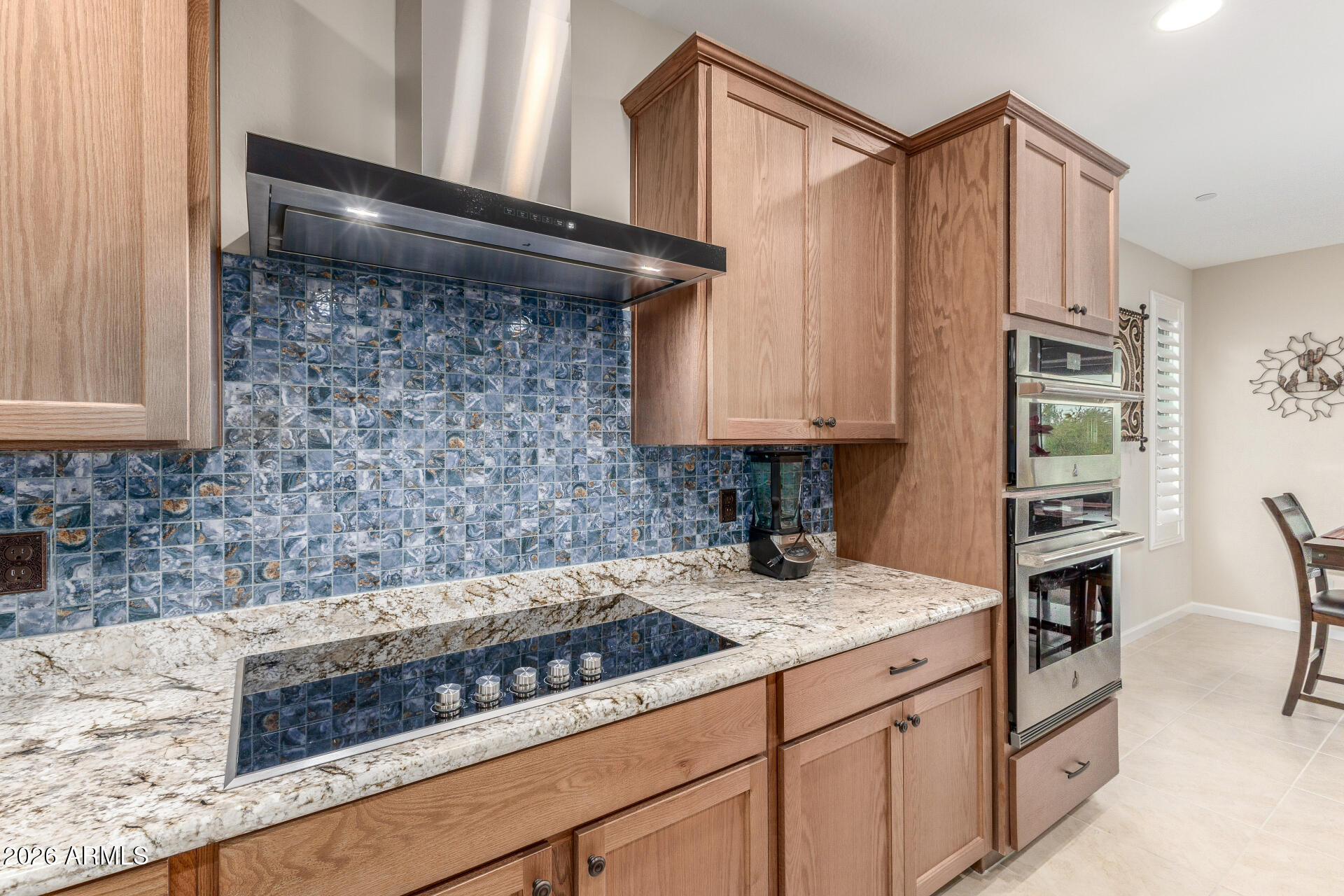 18325 East Spring Valley Court Rio Verde, AZ 85263 - Photo 18 of 50 a kitchen with granite countertop a sink and cabinets