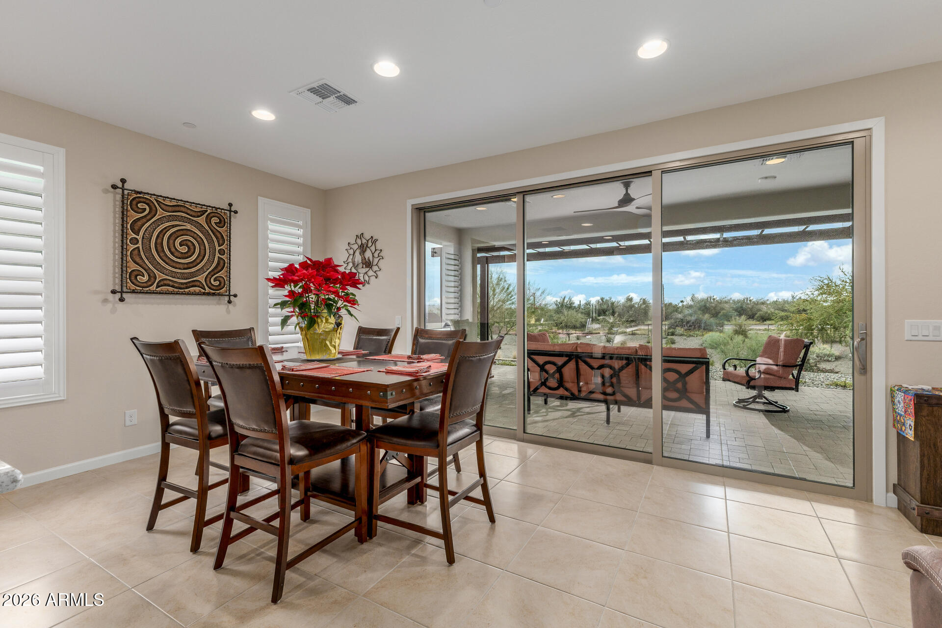 18325 East Spring Valley Court Rio Verde, AZ 85263 - Photo 19 of 50 a dining room with furniture and a floor to ceiling window