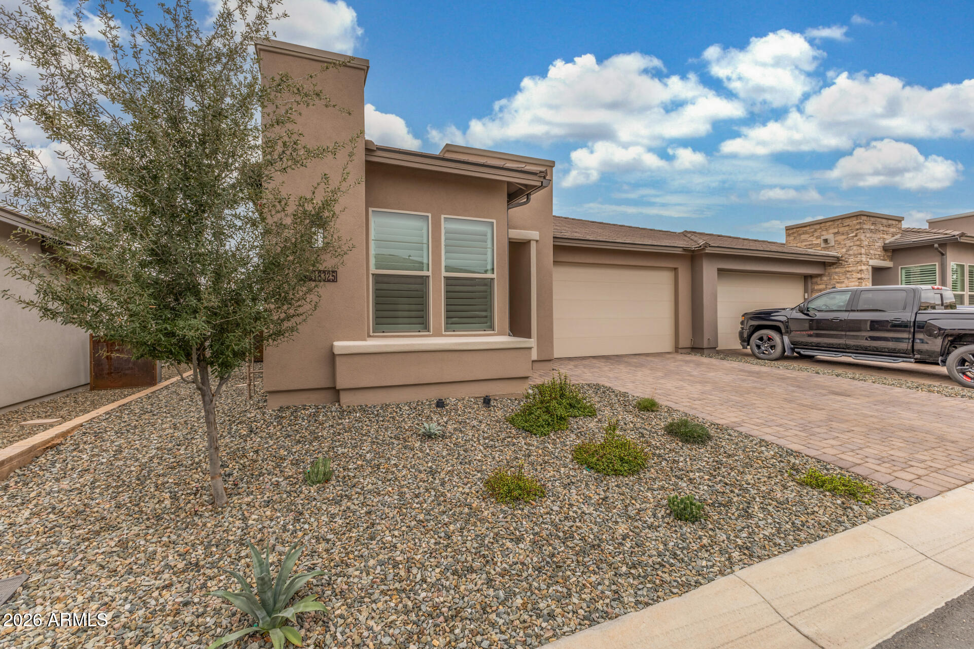 18325 East Spring Valley Court Rio Verde, AZ 85263 - Photo 2 of 50 a front view of a house with a garden