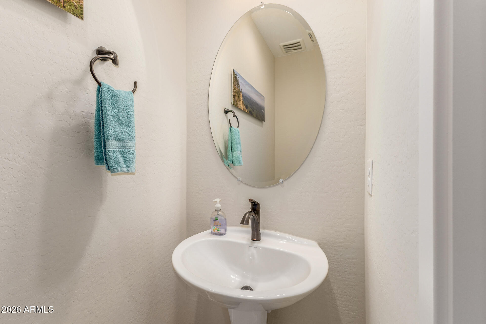 18325 East Spring Valley Court Rio Verde, AZ 85263 - Photo 22 of 50 a bathroom with a sink and a mirror