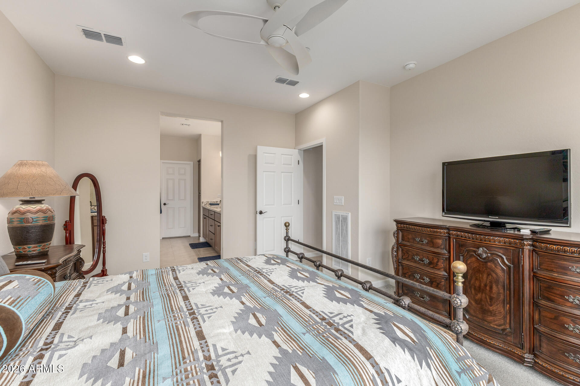 18325 East Spring Valley Court Rio Verde, AZ 85263 - Photo 26 of 50 a bedroom with a bed and a flat tv screen on wall