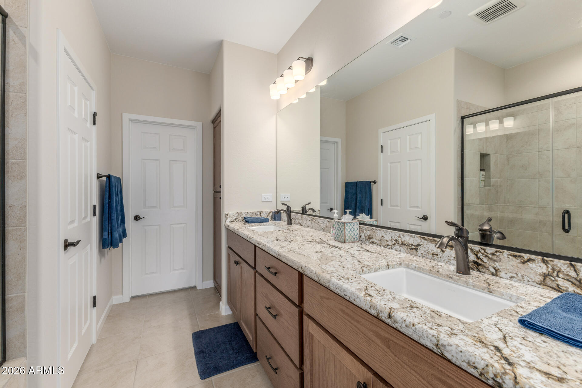 18325 East Spring Valley Court Rio Verde, AZ 85263 - Photo 27 of 50 a bathroom with a granite countertop double vanity sink and mirror