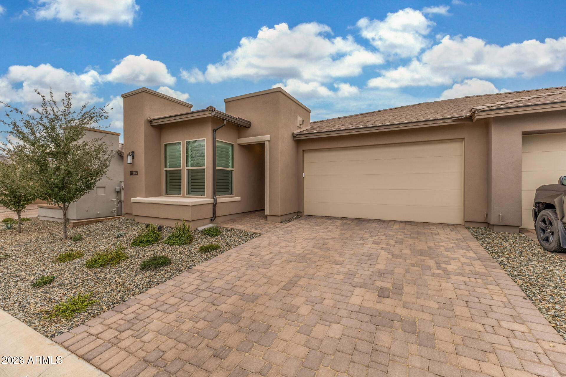 18325 East Spring Valley Court Rio Verde, AZ 85263 - Photo 3 of 50 a front view of a house with a yard and garage