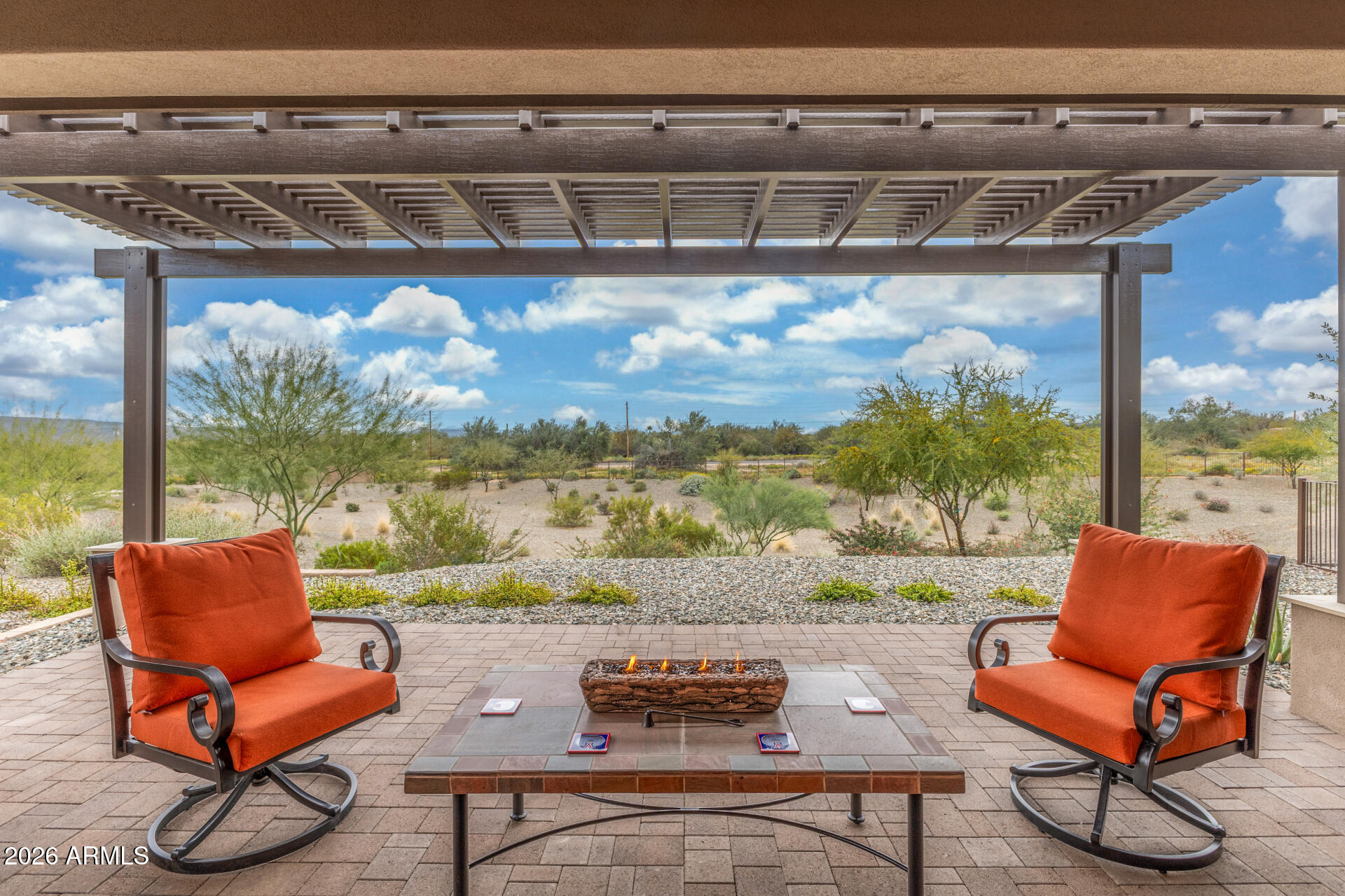 18325 East Spring Valley Court Rio Verde, AZ 85263 - Photo 40 of 50 a outdoor sitting area with a couch and wooden floor