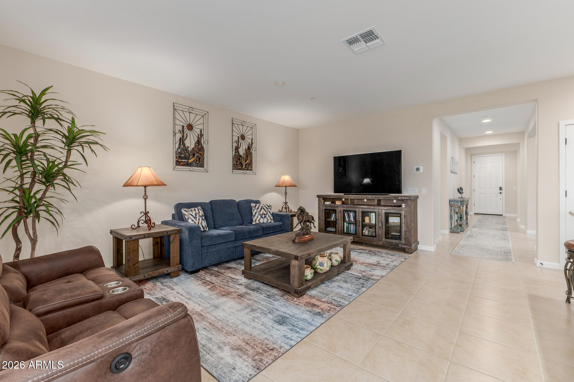 18325 East Spring Valley Court Rio Verde, AZ 85263 - Photo 9 of 50 a living room with furniture and a flat screen tv