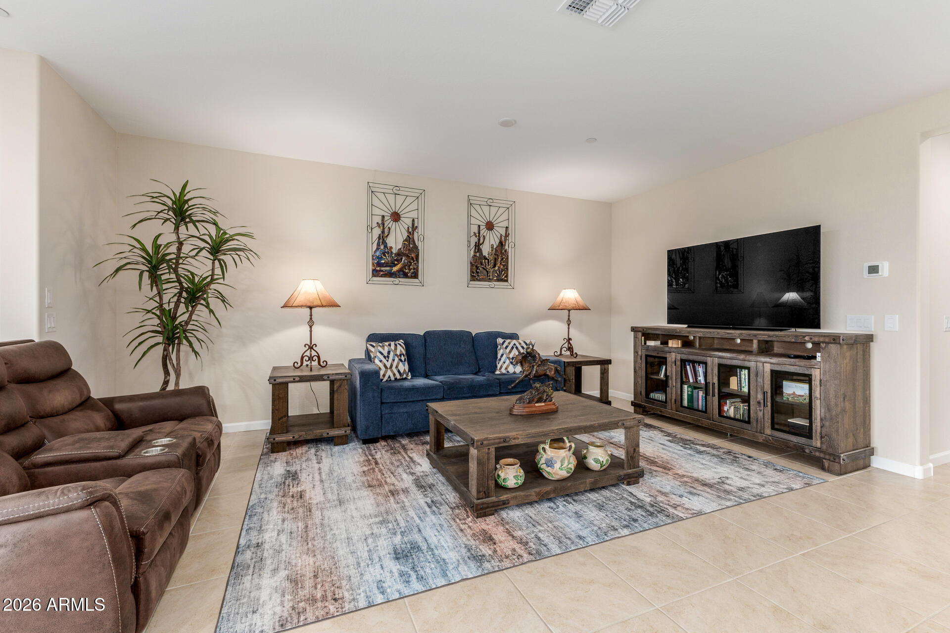 18325 East Spring Valley Court Rio Verde, AZ 85263 - Photo 10 of 50 a living room with furniture and a flat screen tv