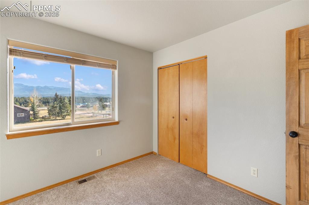 1380 Rampart Range Road Woodland Park, CO 80863 - Photo 14 of 30 an empty room with a window