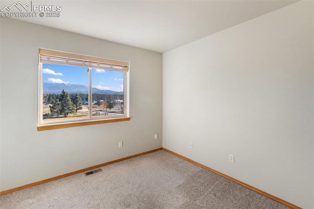 1380 Rampart Range Road Woodland Park, CO 80863 - Photo 15 of 30 an empty room with a window
