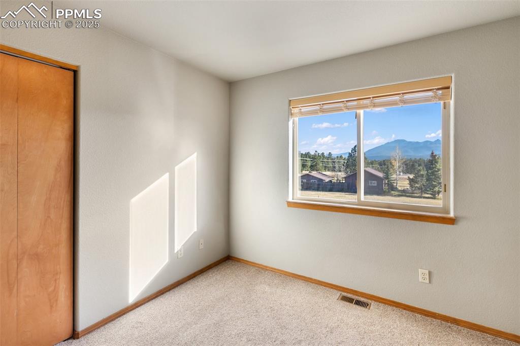 1380 Rampart Range Road Woodland Park, CO 80863 - Photo 16 of 30 an empty room with windows
